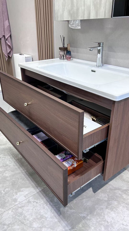 A luxurious solid wood bathroom cabinet with a walnut finish, a washbasin, and an integrated stone slab – an eco-friendly bathroom cabinet.