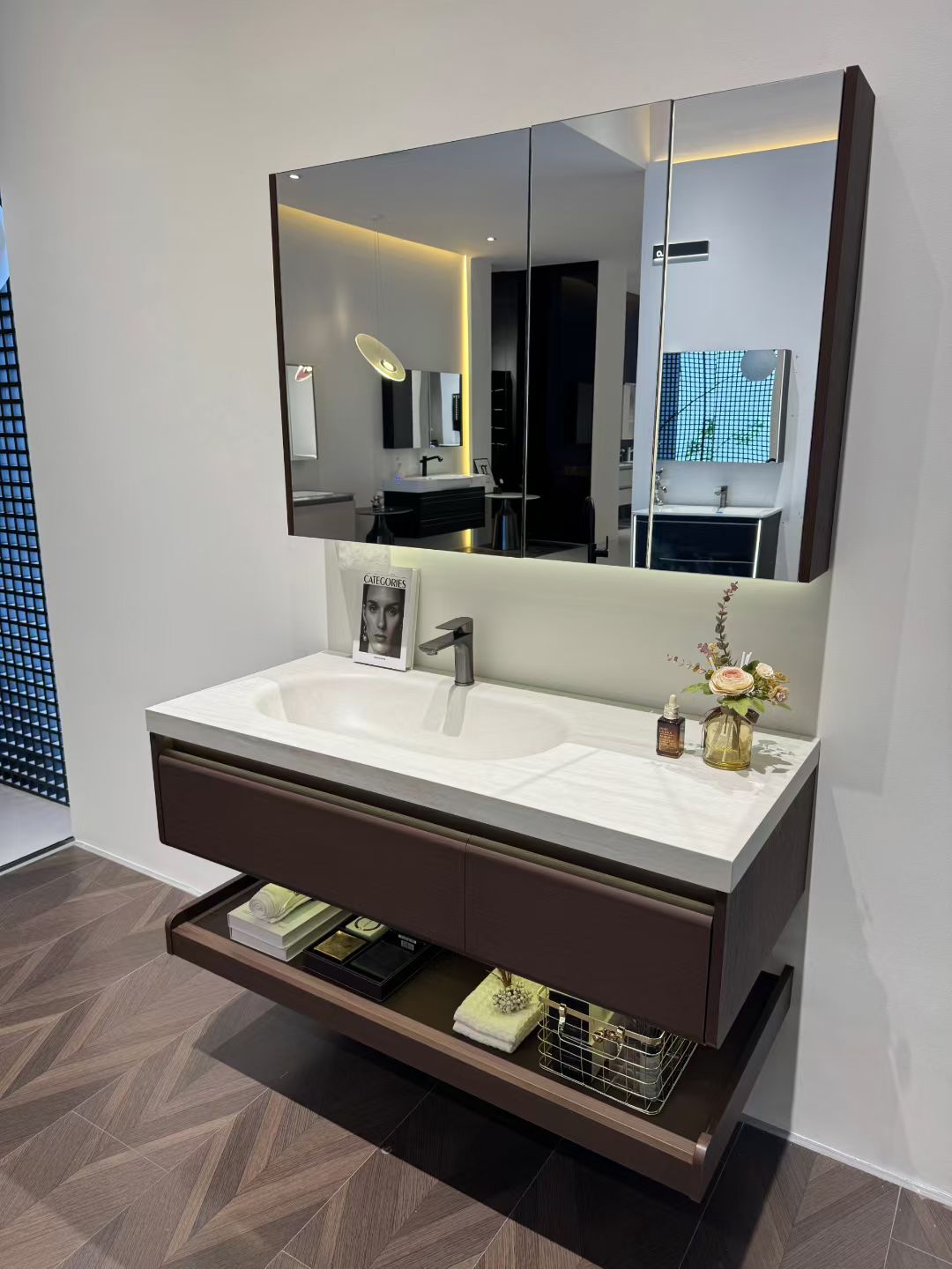 Custom-made cabinet made of red oak, hotel-style custom bathroom vanity, wash basin, and integrated stone slab with seamless design.