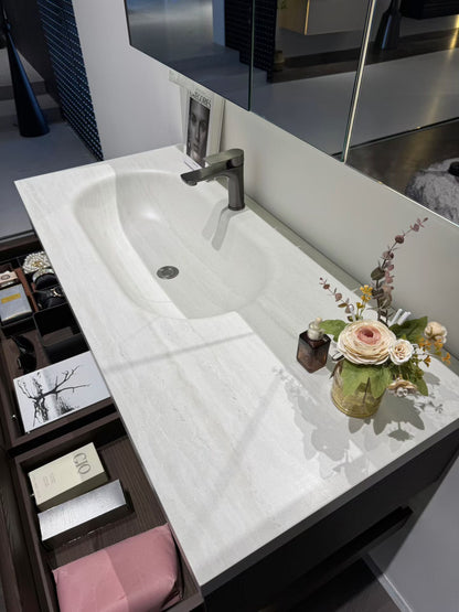 Custom-made cabinet made of red oak, hotel-style custom bathroom vanity, wash basin, and integrated stone slab with seamless design.