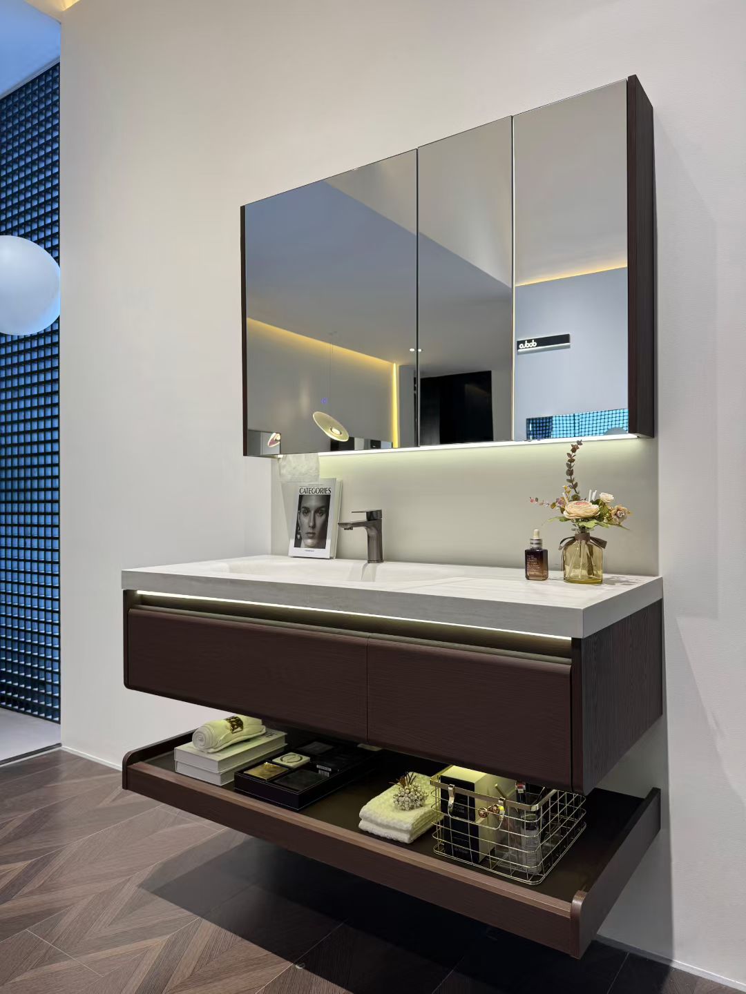 Custom-made cabinet made of red oak, hotel-style custom bathroom vanity, wash basin, and integrated stone slab with seamless design.