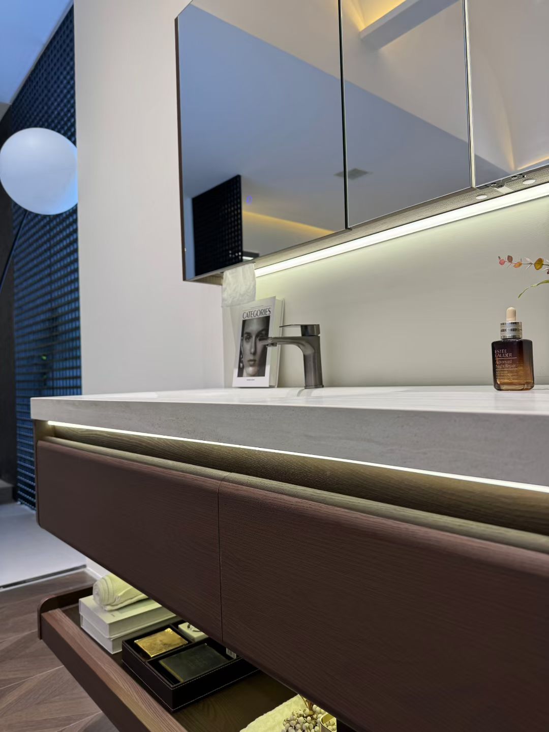 Custom-made cabinet made of red oak, hotel-style custom bathroom vanity, wash basin, and integrated stone slab with seamless design.