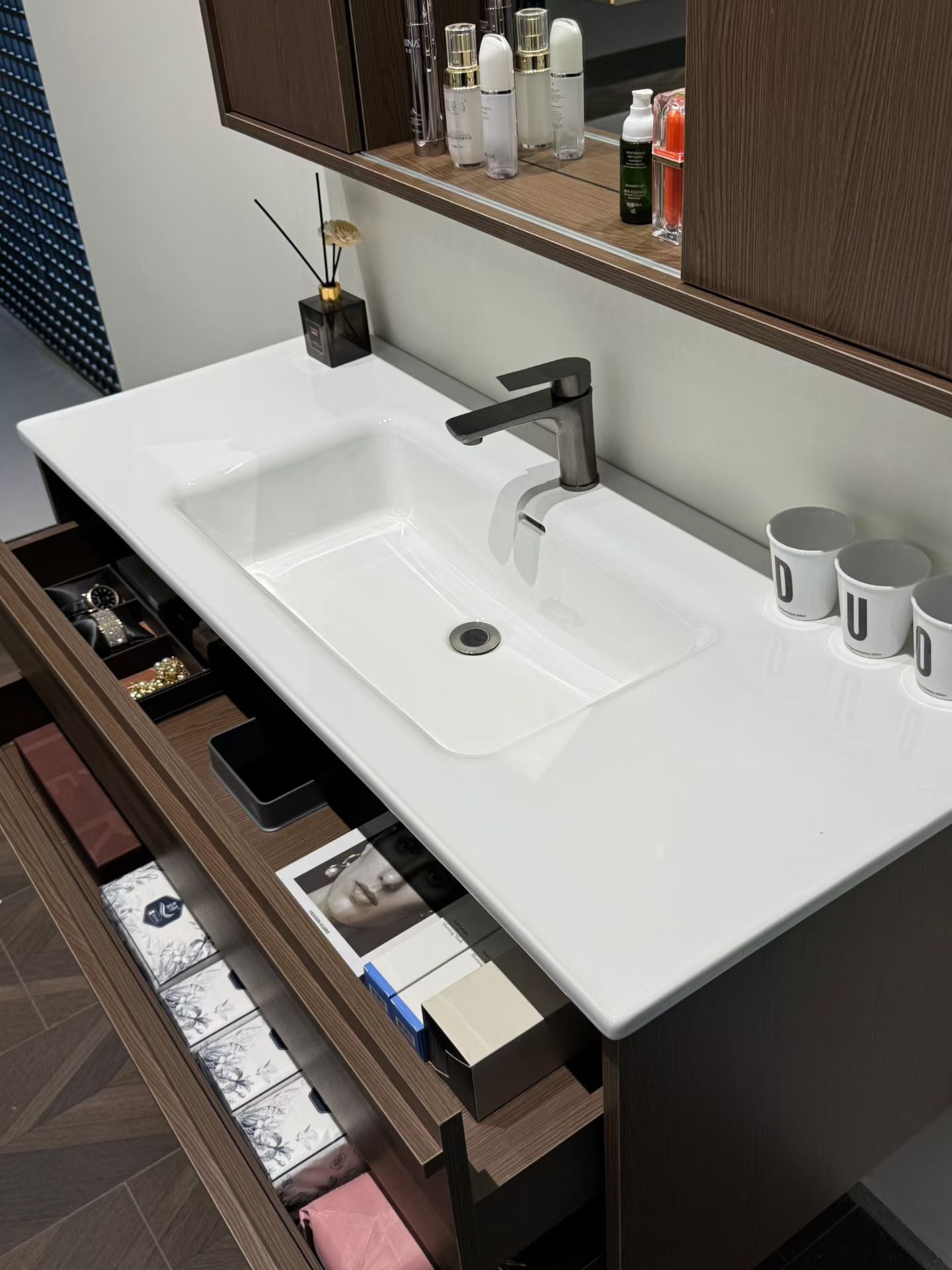 A luxurious solid wood bathroom cabinet with a walnut finish, a washbasin, and an integrated stone slab – an eco-friendly bathroom cabinet