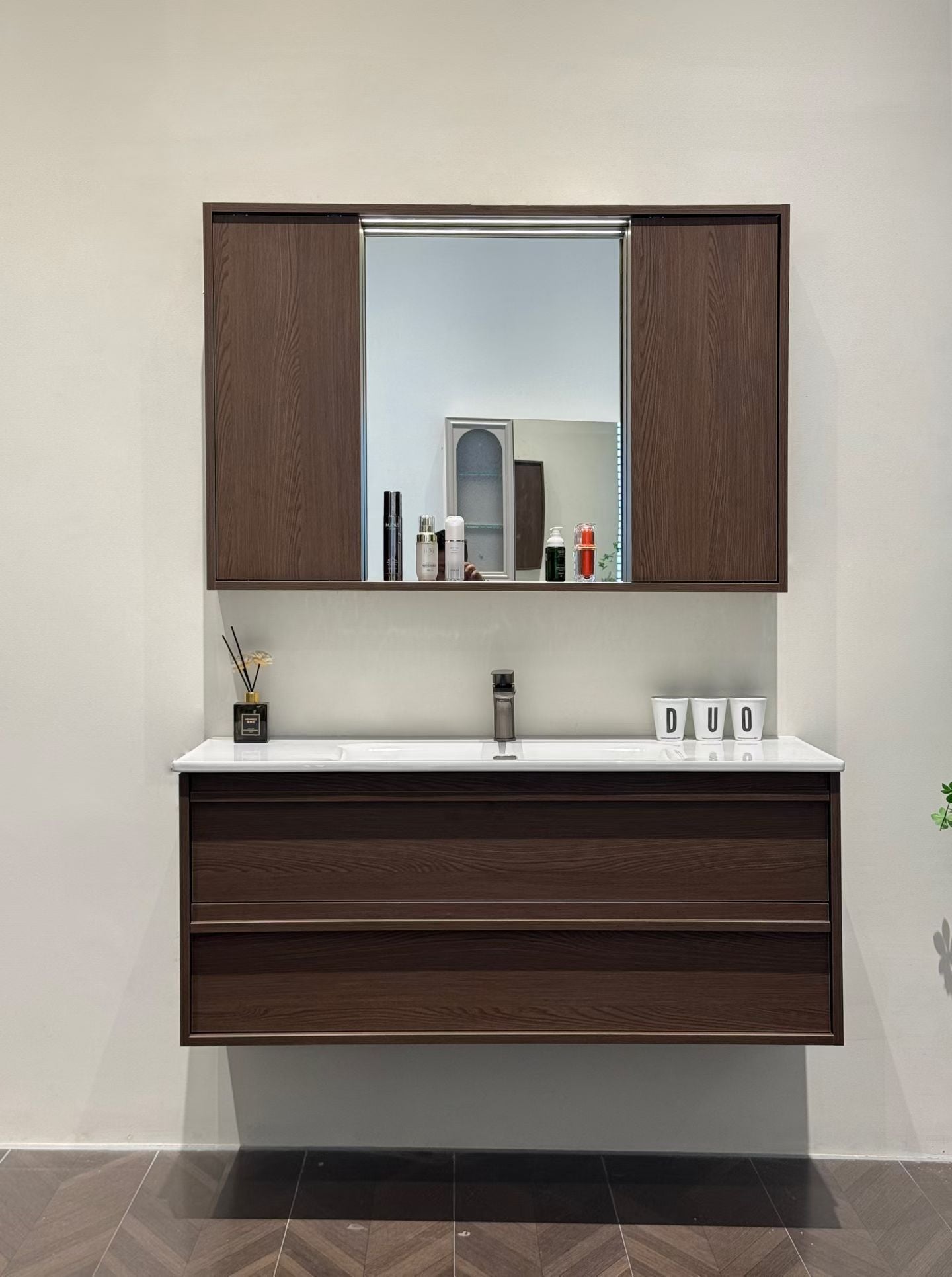 A luxurious solid wood bathroom cabinet with a walnut finish, a washbasin, and an integrated stone slab – an eco-friendly bathroom cabinet