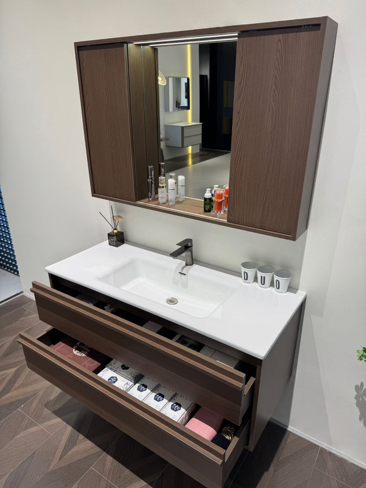 A luxurious solid wood bathroom cabinet with a walnut finish, a washbasin, and an integrated stone slab – an eco-friendly bathroom cabinet