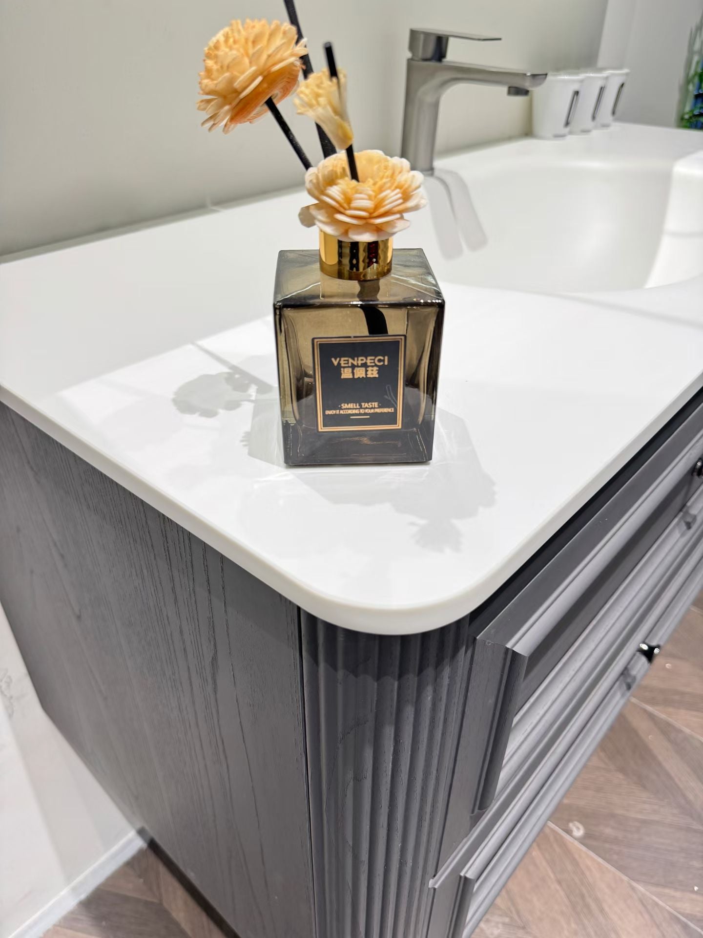 Custom-made solid wood bathroom cabinet with high-temperature stone slab, ceramic, and seamless sink made from eco-friendly materials.