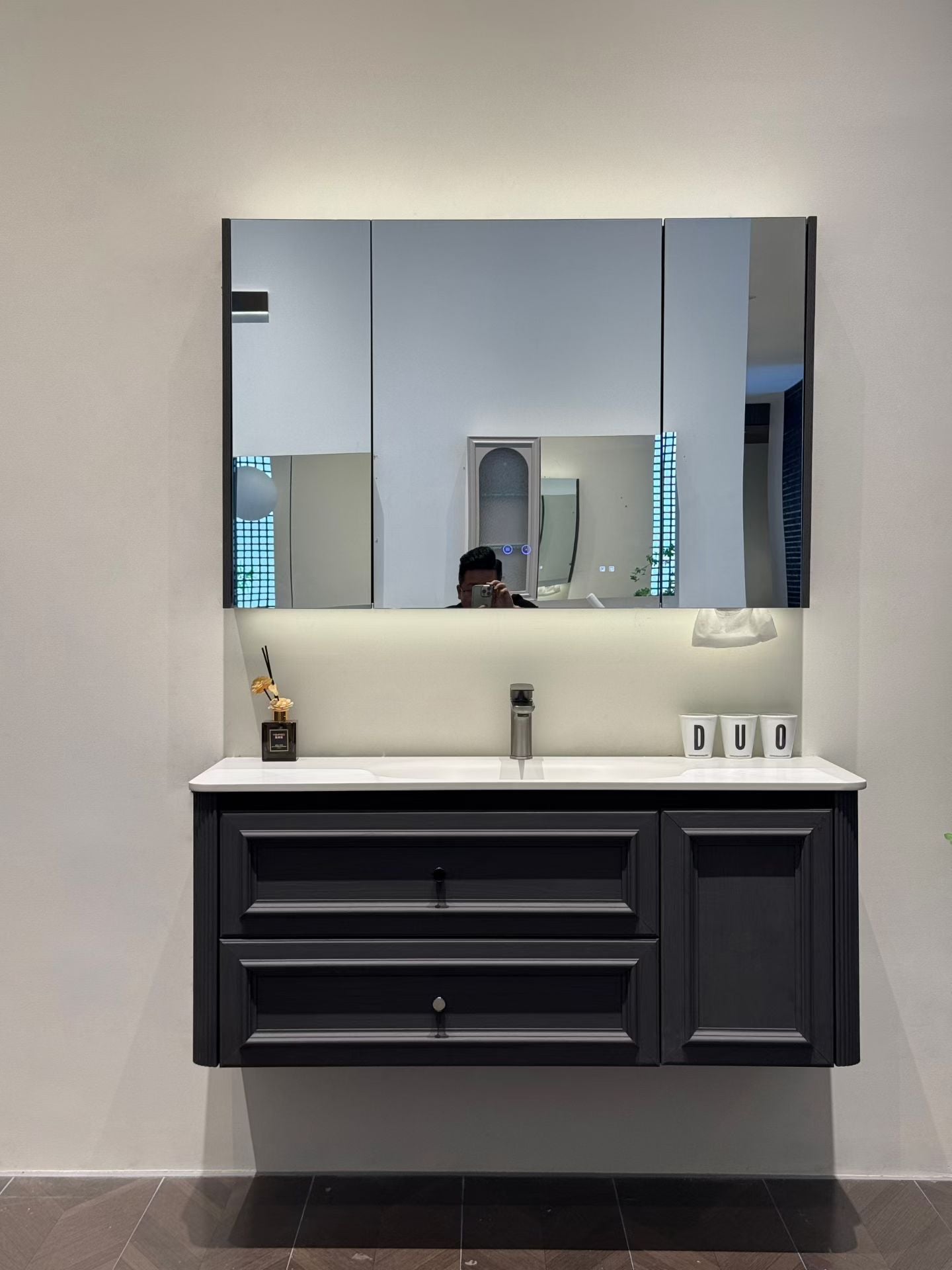 Custom-made solid wood bathroom cabinet with high-temperature stone slab, ceramic, and seamless sink made from eco-friendly materials.