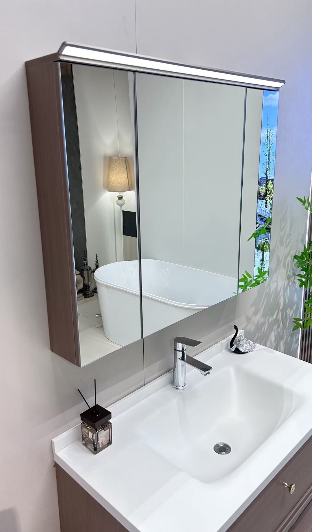 Custom-made cabinet made of red oak, hotel-style custom bathroom vanity, wash basin, and integrated stone slab with seamless design
