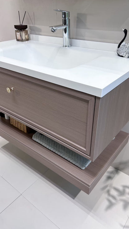 Custom-made cabinet made of red oak, hotel-style custom bathroom vanity, wash basin, and integrated stone slab with seamless design