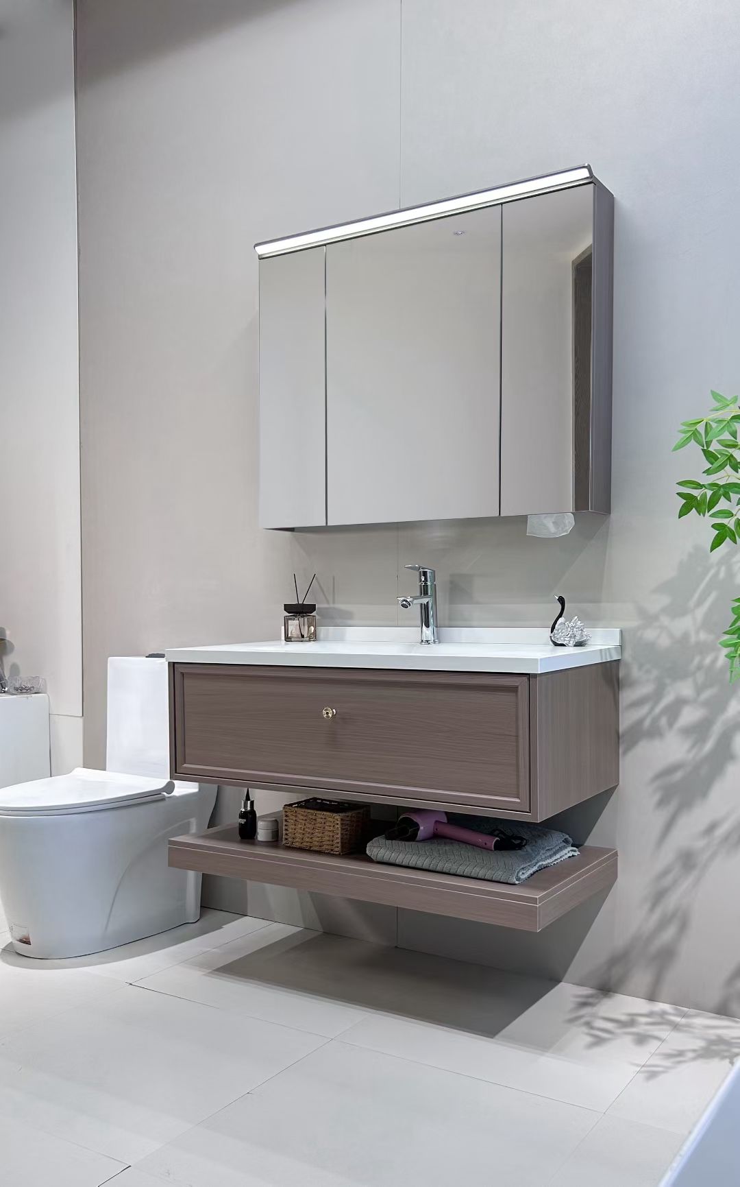 Custom-made cabinet made of red oak, hotel-style custom bathroom vanity, wash basin, and integrated stone slab with seamless design