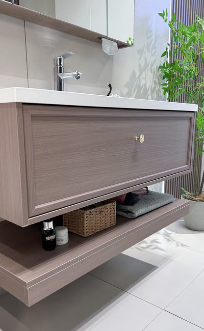 Custom-made cabinet made of red oak, hotel-style custom bathroom vanity, wash basin, and integrated stone slab with seamless design